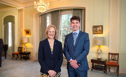 Qld 2024 Rhodes Scholar Jeremy Hunt with Queensland Governor, The Honourable Dr Jeannette Young. A woman and a man standing side-by-side smiling
